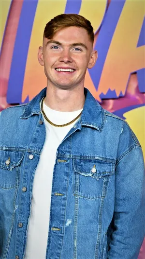 Jack Keating Striking A Confident Pose Wallpaper