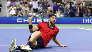 Jack Sock Sitting On Tennis Court Wallpaper