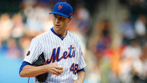 Jacob Degrom Touching A Baseball Wallpaper