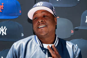 Jadakiss Smilingwith Peace Sign Wallpaper