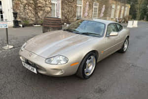 Jaguar X K Coupe Parked Outdoors Wallpaper