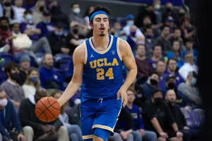 Jaime Jaquez Jr In Action During A Basketball Game Wallpaper