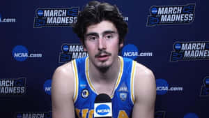 Jaime Jaquez Jr. In Action During A Basketball Match Wallpaper