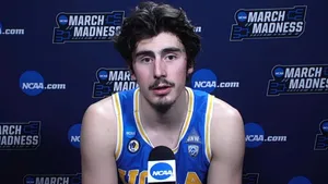 Jaime Jaquez Jr. In Action During A Basketball Match Wallpaper