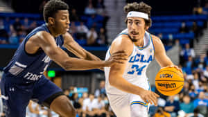 Jaime Jaquez Jr. In Action During A Professional Basketball Game Wallpaper