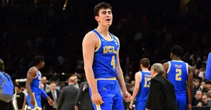 Jaime Jaquez Jr In Action On Basketball Court Wallpaper