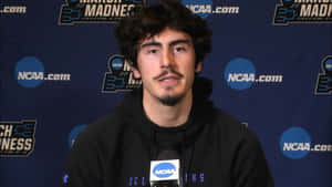 Jaime Jaquez Jr Passionately Playing Basketball On The Court. Wallpaper