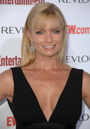 Jaime Pressly Striking A Confident Pose Wallpaper