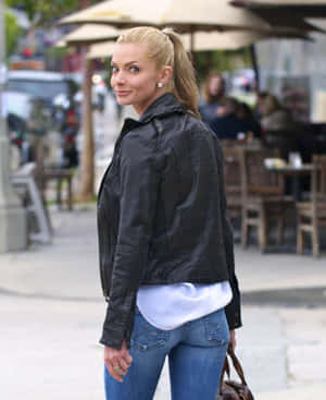 Jaime Pressly Striking A Pose In Stylish Outfit Wallpaper