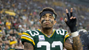 Jaire Alexander Peace Sign On Field Wallpaper