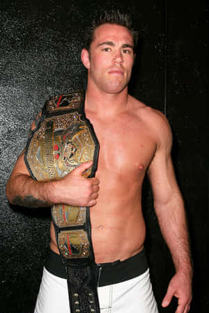 Jake Shields Celebrates Victory With Championship Belt Wallpaper