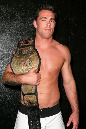 Jake Shields Celebrates Victory With Championship Belt Wallpaper