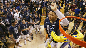 Jalen Brunson Removing Net In The Ring Wallpaper