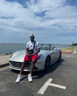 Jamahal Hill Sitting On Hood Of Ferrari Wallpaper