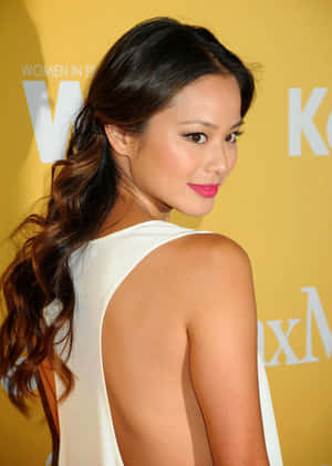 Jamie Chung Posing At A Photoshoot. Wallpaper