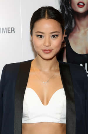 Jamie Chung Posing Elegantly In A Stylish Outfit Wallpaper