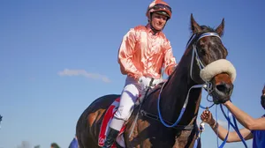 Jamie Kah In Action During A Horse Racing Event Wallpaper