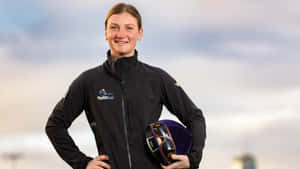 Jamie Kah In Action During A Thrilling Horse Race Wallpaper