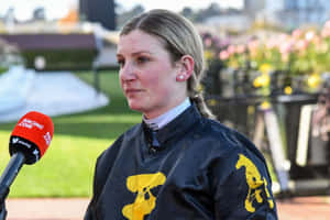 Jamie Kah Winning A Horse Race Wallpaper