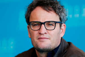 Jason Clarke Portrait Blue Background Wallpaper