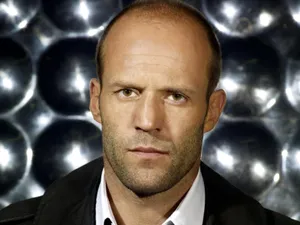 Jason Statham Exhibiting Confidence With His Iconic Bald Look Wallpaper