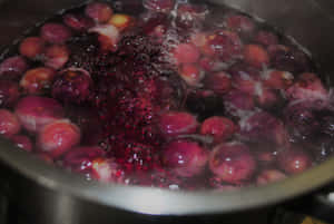 Java Plums In A Large Stainless Steel Pot Wallpaper