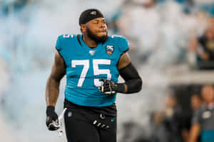 Jawaan Taylor In Action During A Football Game Wallpaper