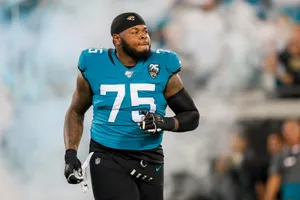 Jawaan Taylor In Action During A Football Game Wallpaper