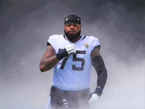 Jawaan Taylor In Action During A Football Game Wallpaper