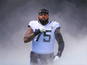 Jawaan Taylor In Action During A Football Game Wallpaper