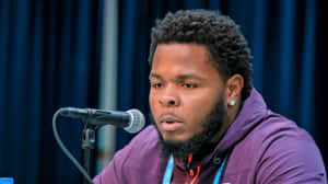 Jawaan Taylor In Action On The Football Field Wallpaper