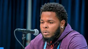 Jawaan Taylor In Action On The Football Field Wallpaper