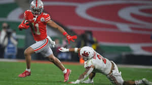 Jaxon Smith Njigba Evading Tackle Wallpaper