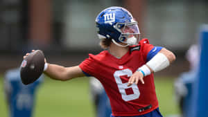 Jaxson Dart Throwing Football Wallpaper