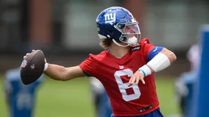 Jaxson Dart Throwing Football Wallpaper