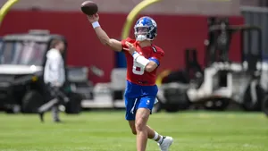 Jaxson Dart Throwing Football Wallpaper