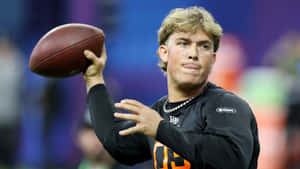 Jaxson Dart Throwing Football Wallpaper