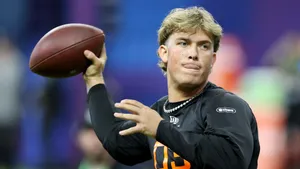 Jaxson Dart Throwing Football Wallpaper