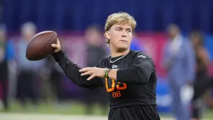 Jaxson Dart Throwing Football Wallpaper