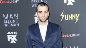 Jay Baruchel Smiling In An Outdoor Setting