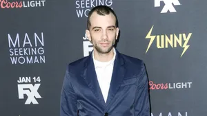Jay Baruchel Smiling In An Outdoor Setting