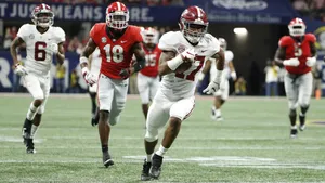 Jaylen Waddle In Action During College Football Game Wallpaper