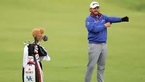 Jb Holmes With Golf Equipment Bag Wallpaper