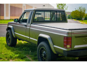 Jeep Comanche Pickup Truck In Action Wallpaper