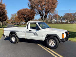 Jeep Comanche Showcasing Its Rugged Design And Off-road Capabilities Wallpaper