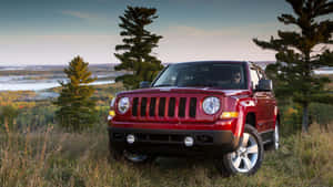 Jeep Patriot Exploring Off-road Terrain Wallpaper