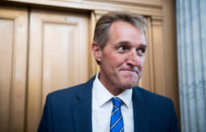 Jeff Flake Holding Back A Smile Wallpaper