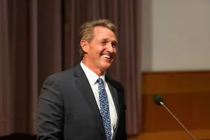 Jeff Flake Smiling On Podium Wallpaper