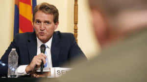 Jeff Flake Talking While Holding Microphone Wallpaper