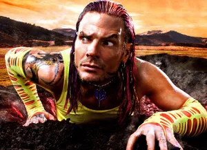 Jeff Hardy Climbing Up From Volcano Wallpaper
